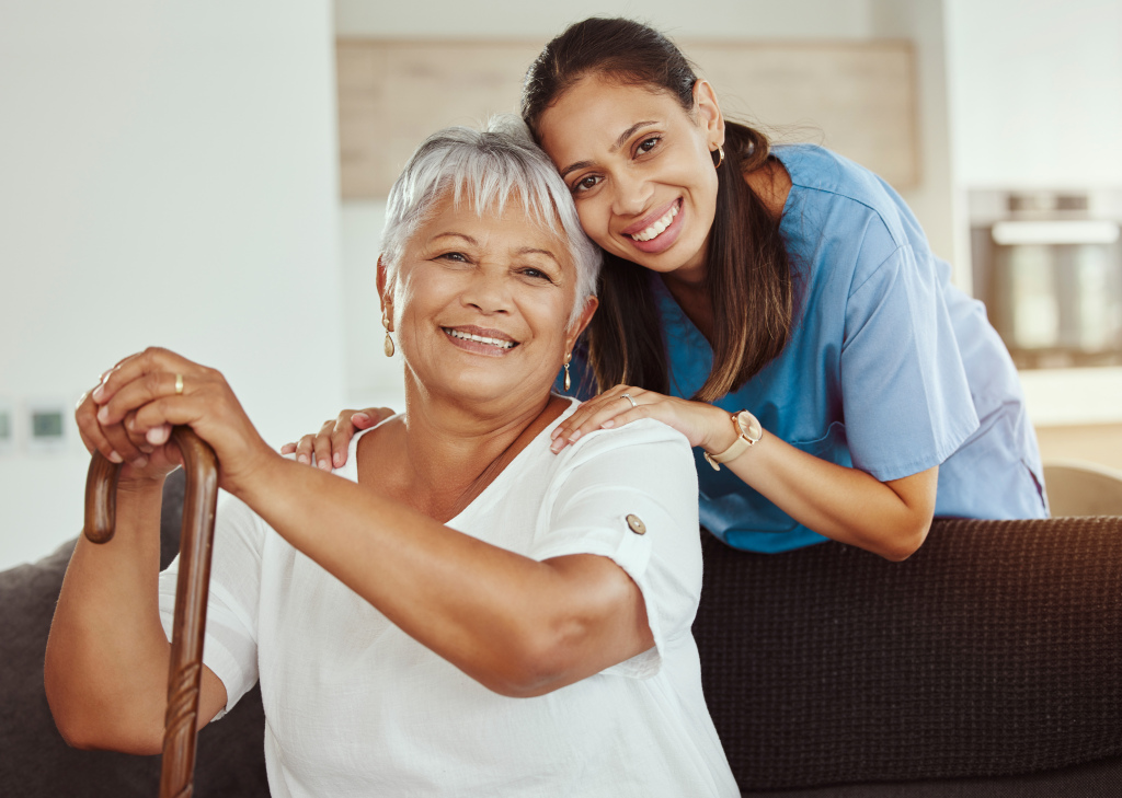 Caregiver helping senior woman